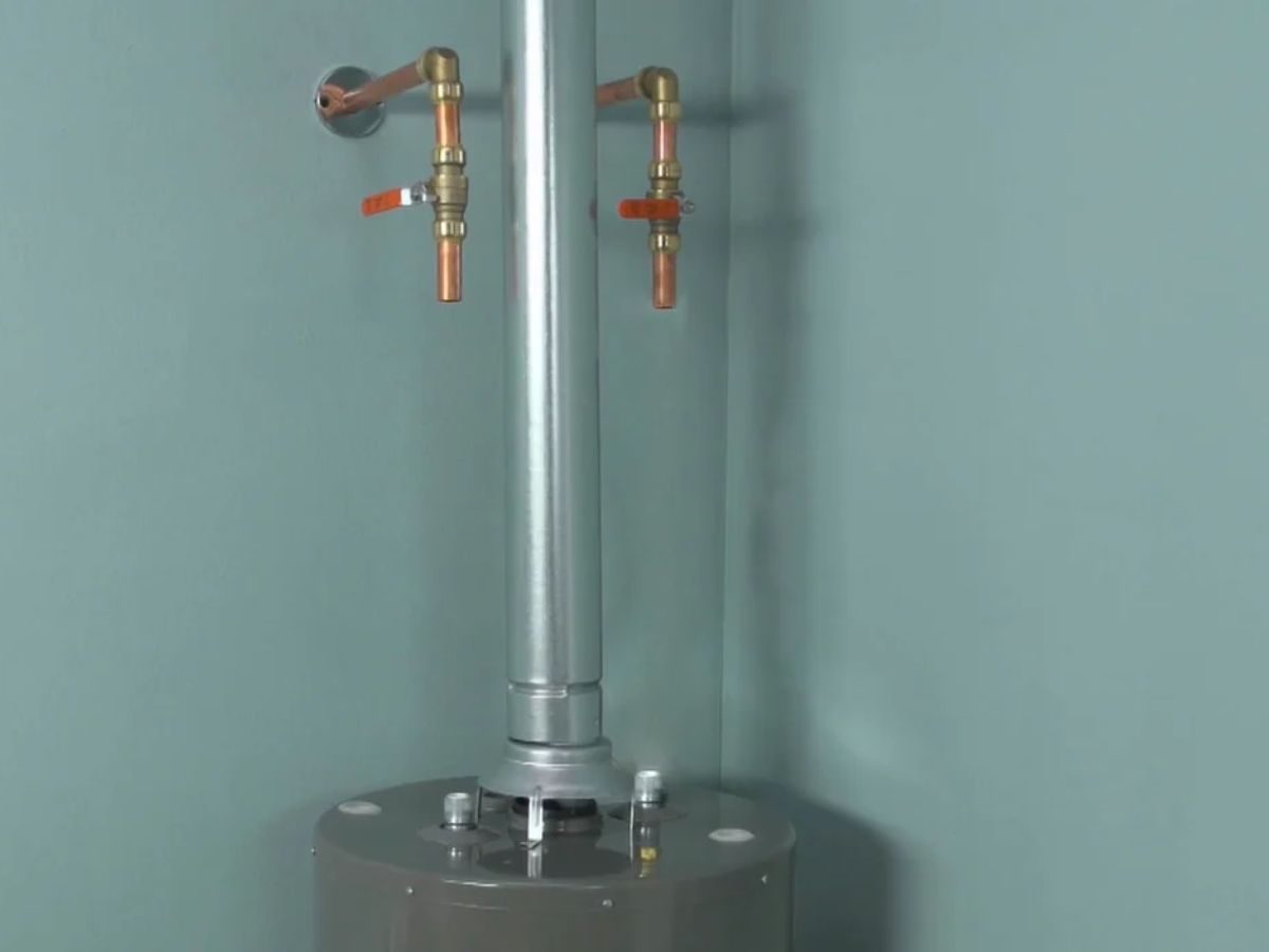 Plumber working on a residential water heater